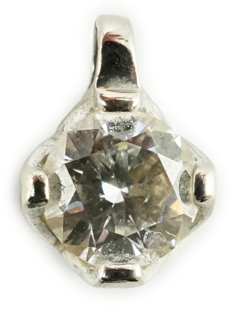 A modern 18ct white gold and solitaire diamond set pendant, gross weight 0.4 grams, stone diameter 5.1mm.